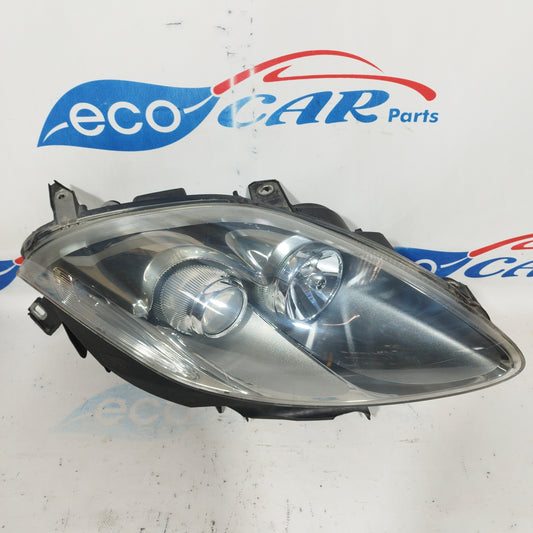 Fanale anteriore dx Fiat Bravo 2010 fondo scuro e freccia bianca ecoAC4541