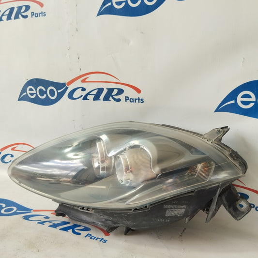 Fanale anteriore sx Fiat Bravo 2008 fondo scuro freccia bianca ecoAG2891