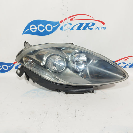 Fanale anteriore dx Fiat Bravo 2010 fondo scuro e freccia bianca ecoAC4541
