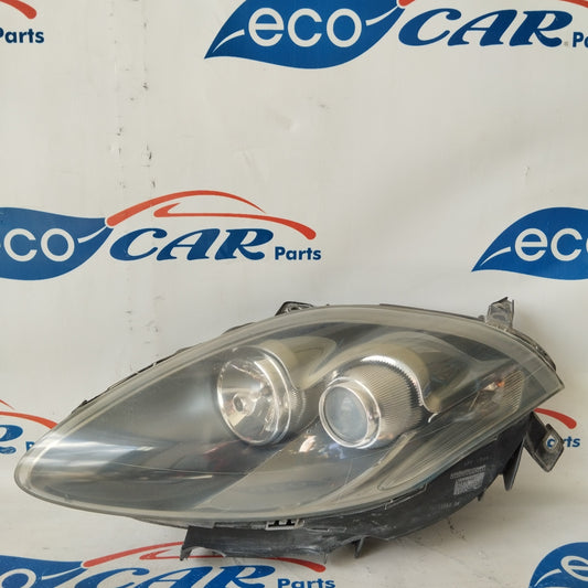 Fanale anteriore sx Fiat Bravo 2008 fondo scuro freccia bianca ecoAG2891