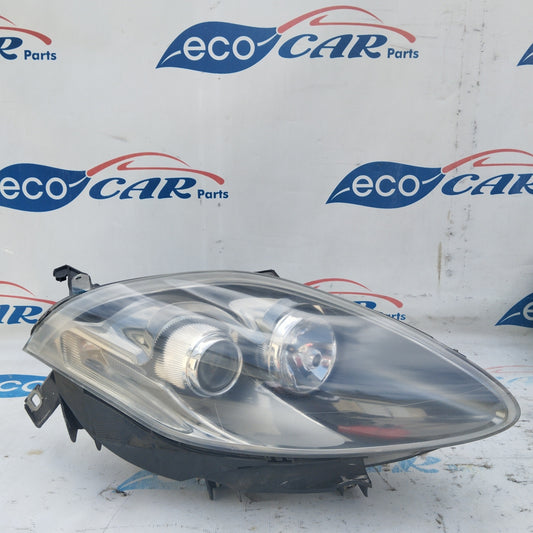 Fanale anteriore dx Fiat Bravo 2008 fondo scuro freccia bianca ecoAG4698