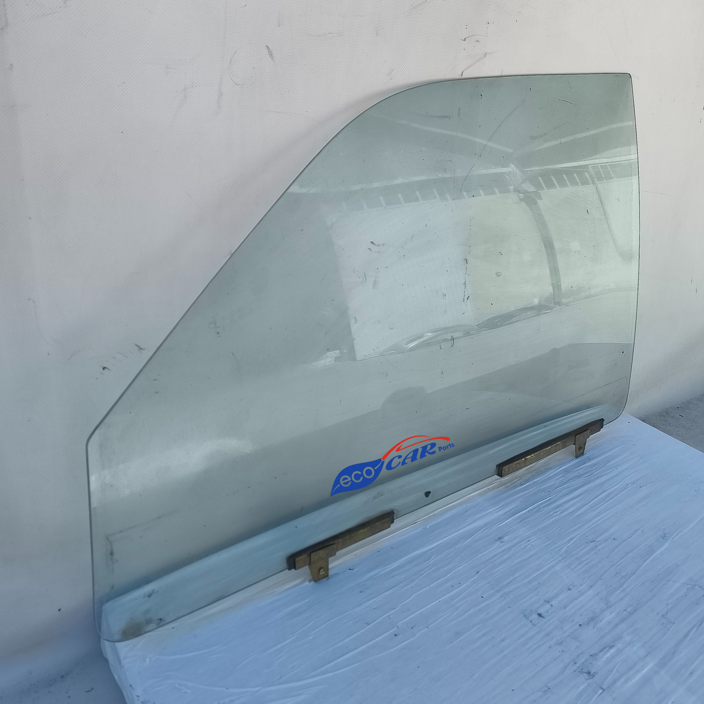 Vetro scendente anteriore sx Mitsubishi L200 anno 2003 ecoAG7363