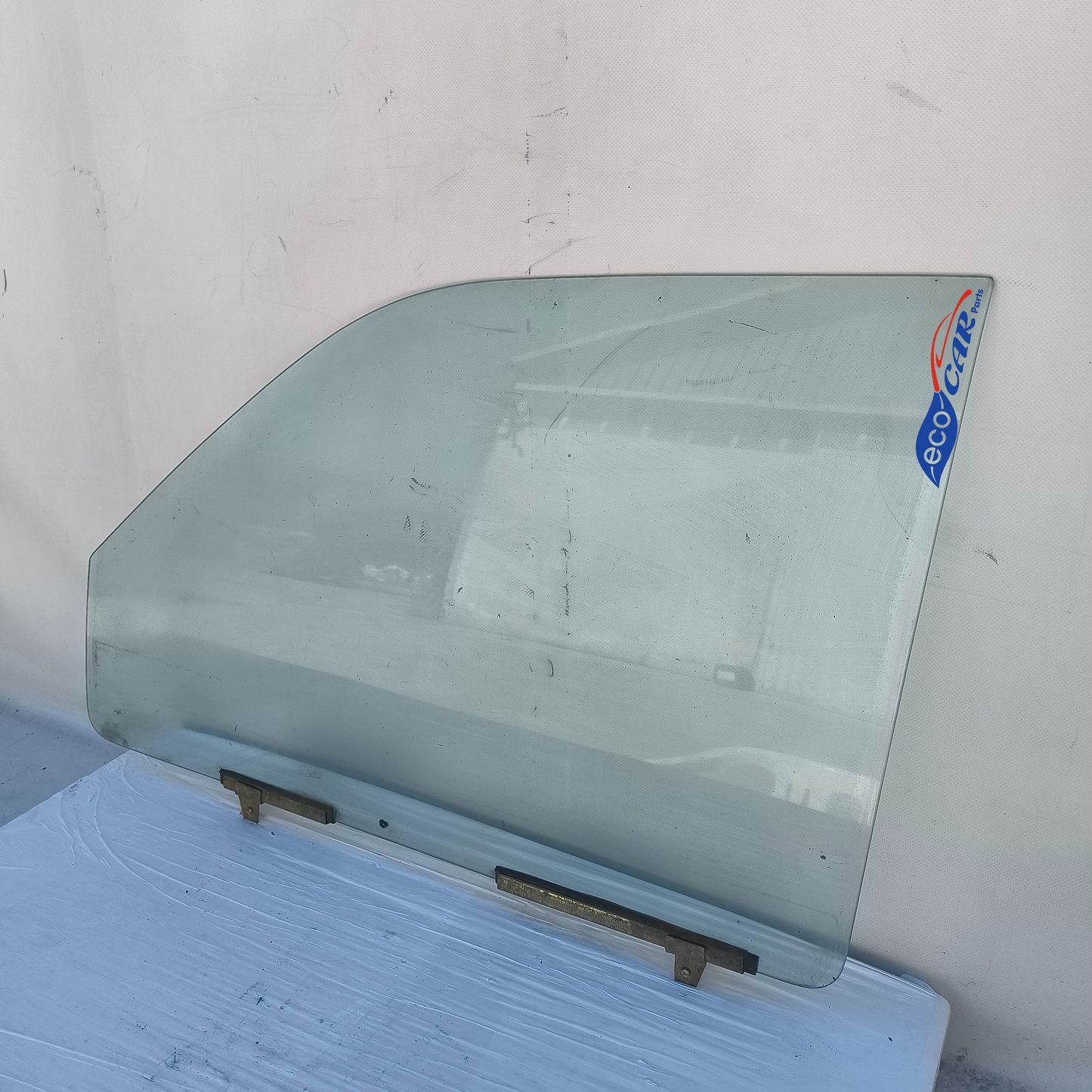 Vetro scendente anteriore sx Mitsubishi L200 anno 2003 ecoAG7363