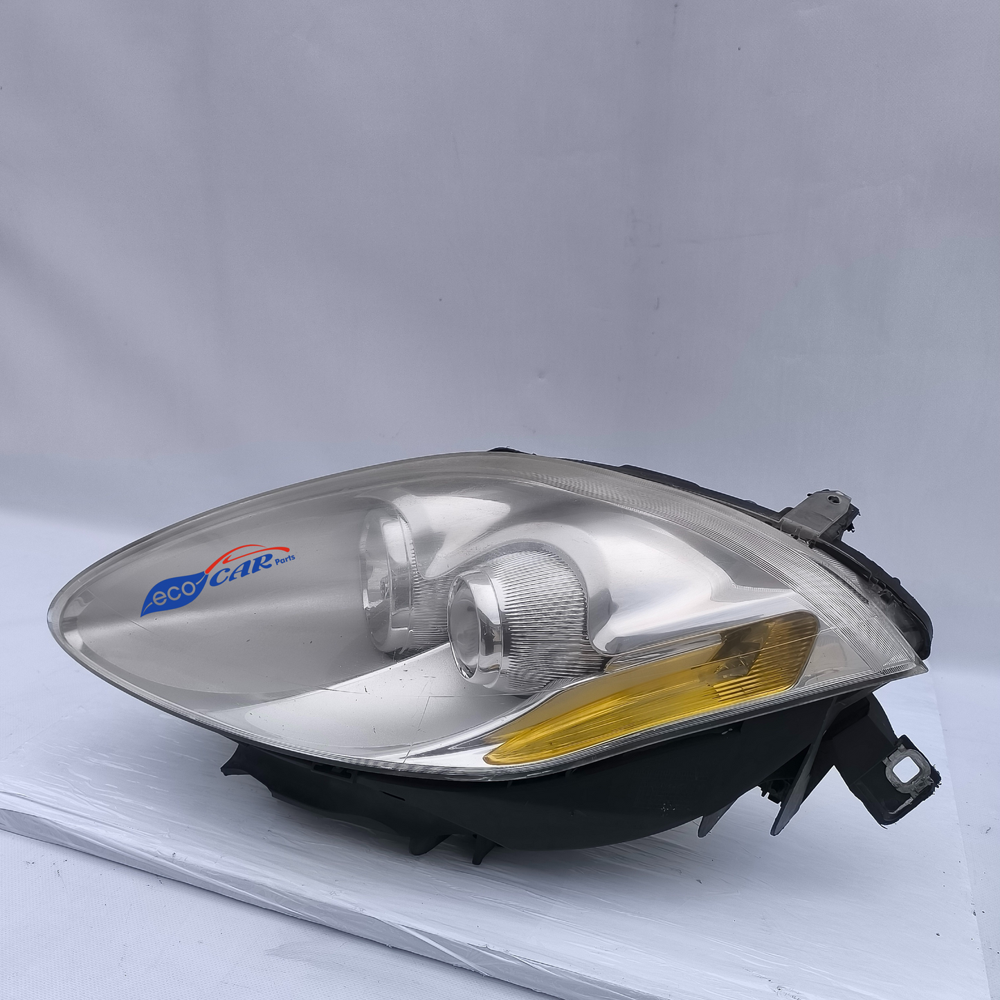 Fanale anteriore sx Fiat Bravo 2008 fondo chiaro freccia gialla ecoAG6162