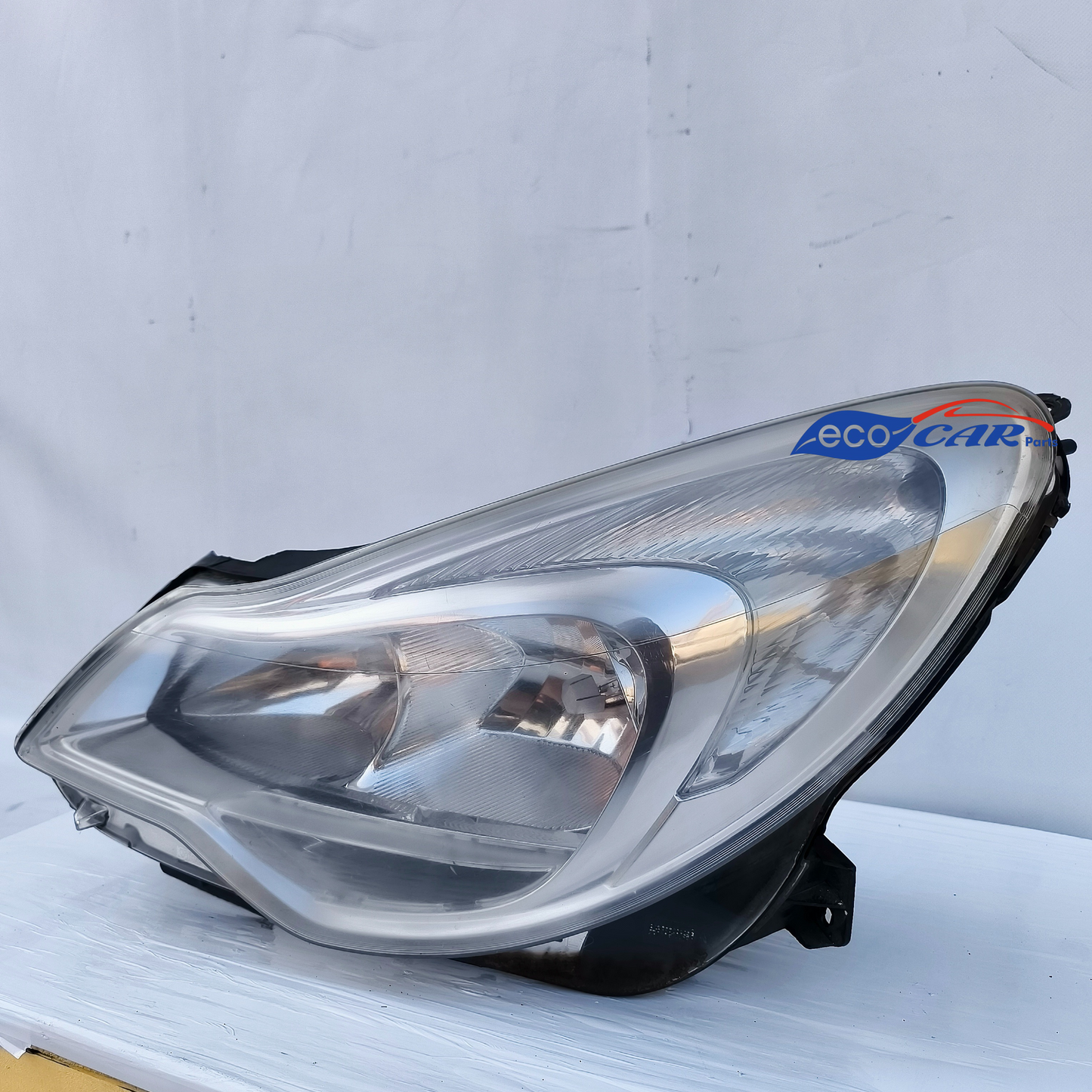 Left front headlight Opel Corsa D restyling model ecoAG7146 slightly scratched