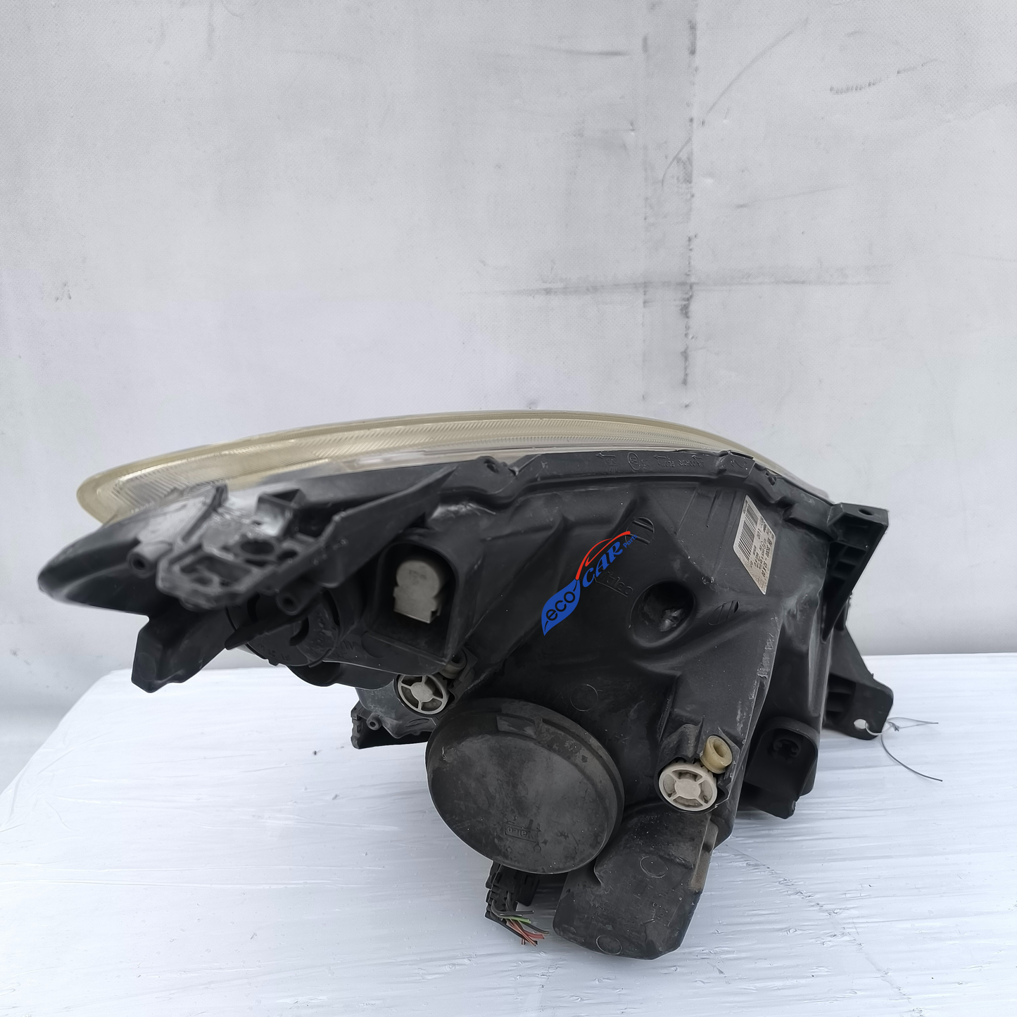 Opel Agila B ecoAG7573 linker Frontscheinwerfer, Anschlag mit Silikon repariert