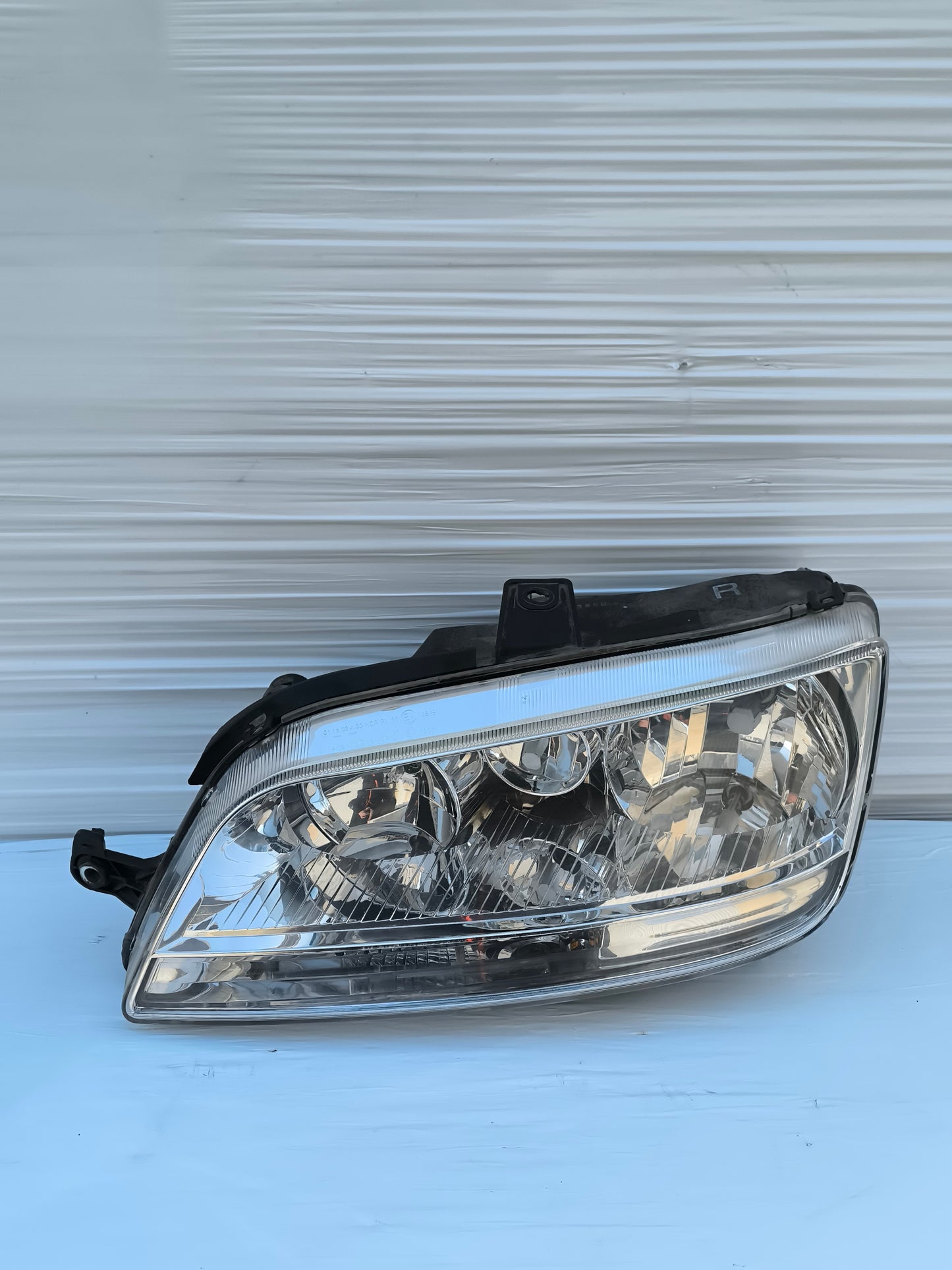 Fanale anteriore sx freccia bianca Fiat Idea / Multipla ecoAG7846