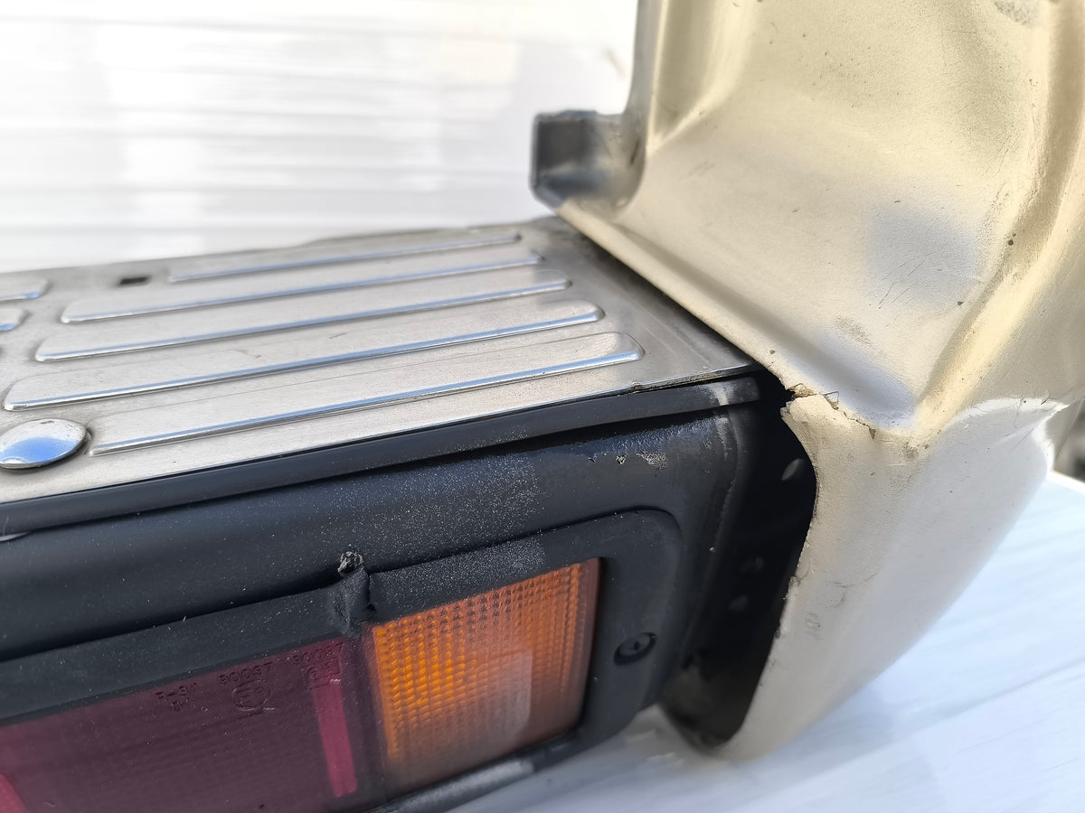 Paraurti posteriore Mitsubishi Pajero II  3 porte (V20) / 5 porte (V40) anno 1996-1999 ecoAG10003