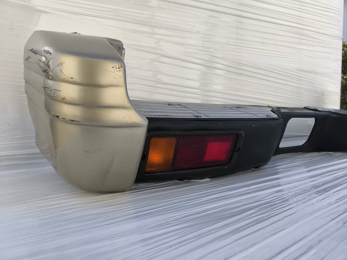 Paraurti posteriore Mitsubishi Pajero II  3 porte (V20) / 5 porte (V40) anno 1996-1999 ecoAG10003