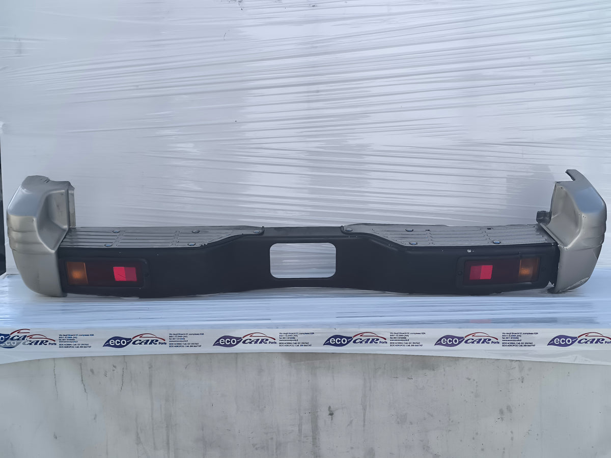 Paraurti posteriore Mitsubishi Pajero II  3 porte (V20) / 5 porte (V40) anno 1996-1999 ecoAG10003