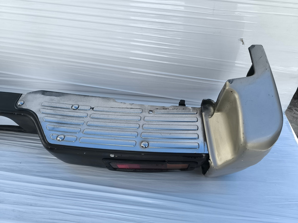 Paraurti posteriore Mitsubishi Pajero II  3 porte (V20) / 5 porte (V40) anno 1996-1999 ecoAG10003