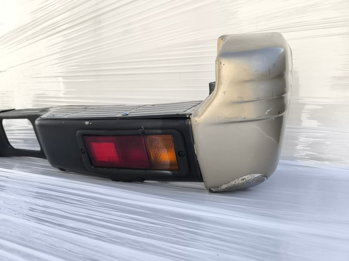 Paraurti posteriore Mitsubishi Pajero II  3 porte (V20) / 5 porte (V40) anno 1996-1999 ecoAG10003