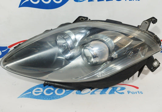 Fanale anteriore sx Fiat Bravo 2010 fondo scuro e freccia bianca ecoAC1315